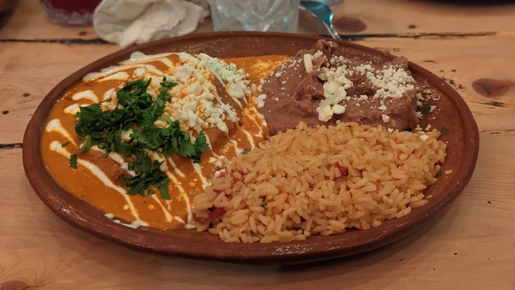 Mexican plate with enchiladas, rice, and refried beans at Hugo’s Mexican Restaurant in Chilliwack.