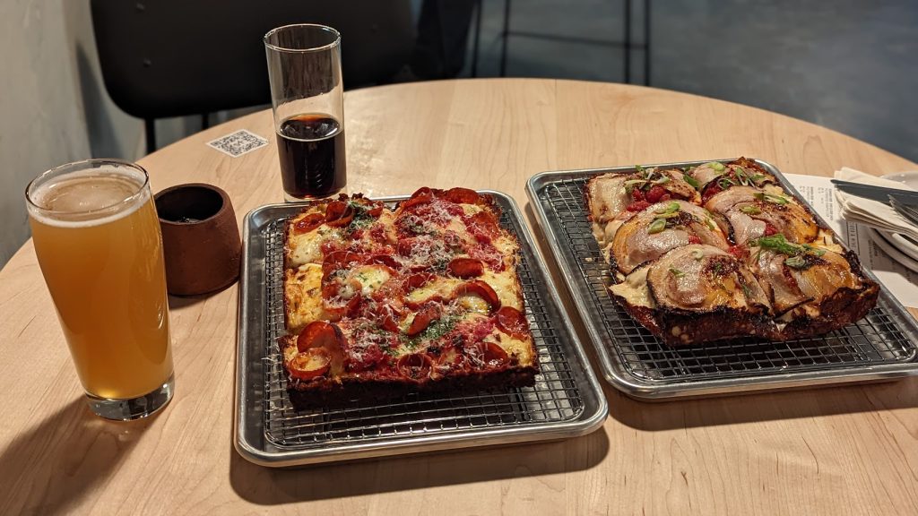 Pizza and beer on the patio at Sidekick Brewing